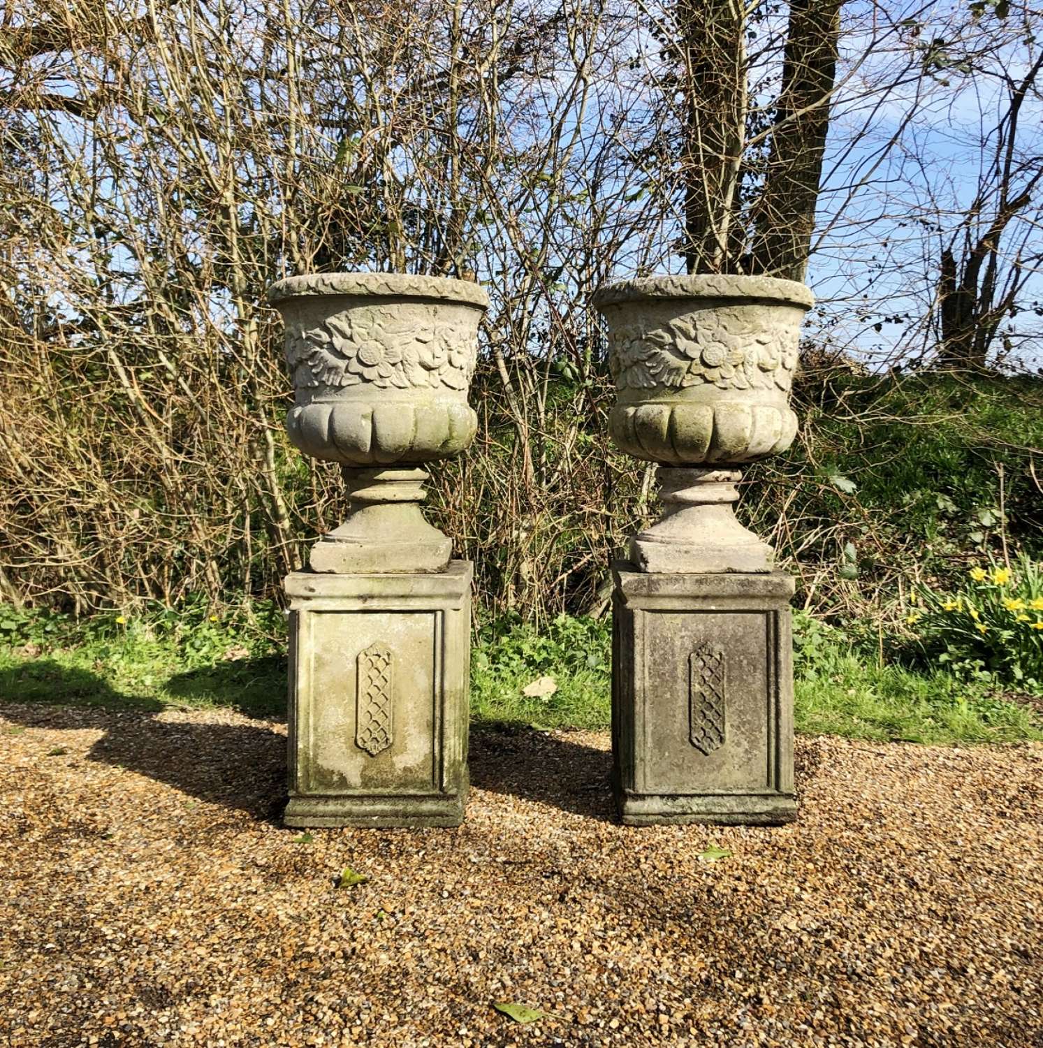 Pair of Large Flower Urns with Pedestals
