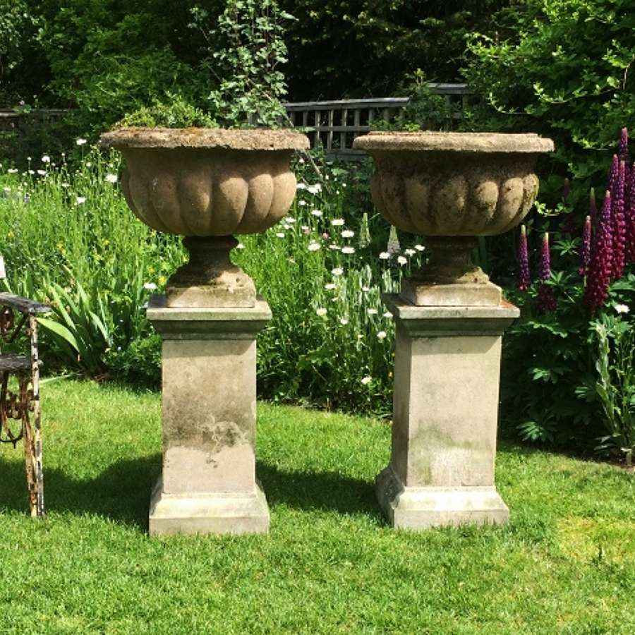 Pair of Lobed Urns and Pedestals