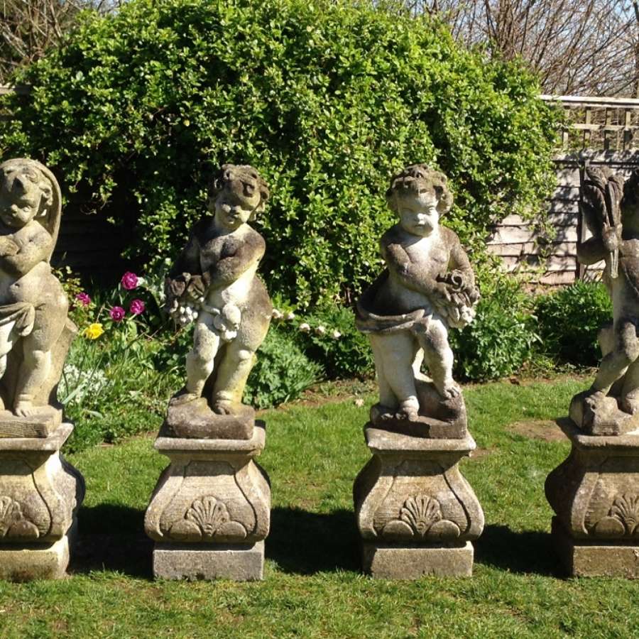 Set of Four Carved Limestone Statues
