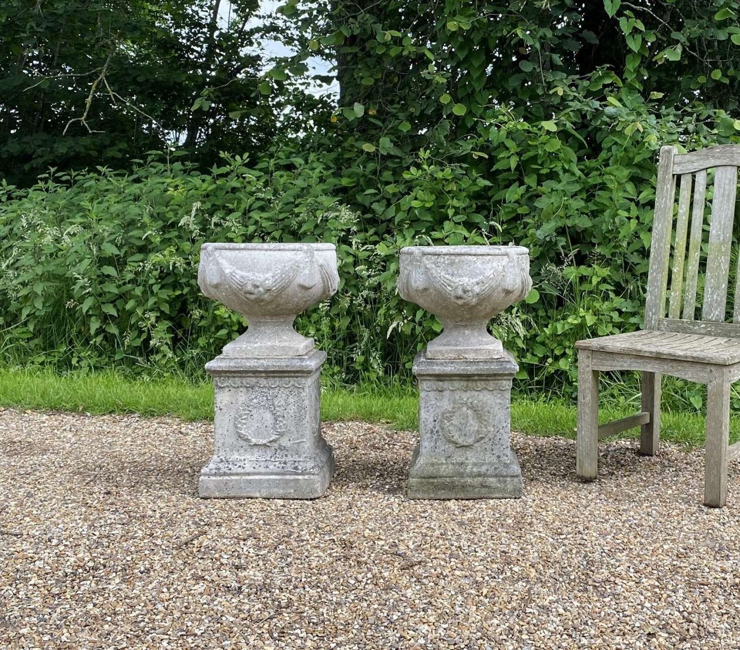Pair of Small Goblet Urns with Pedestals