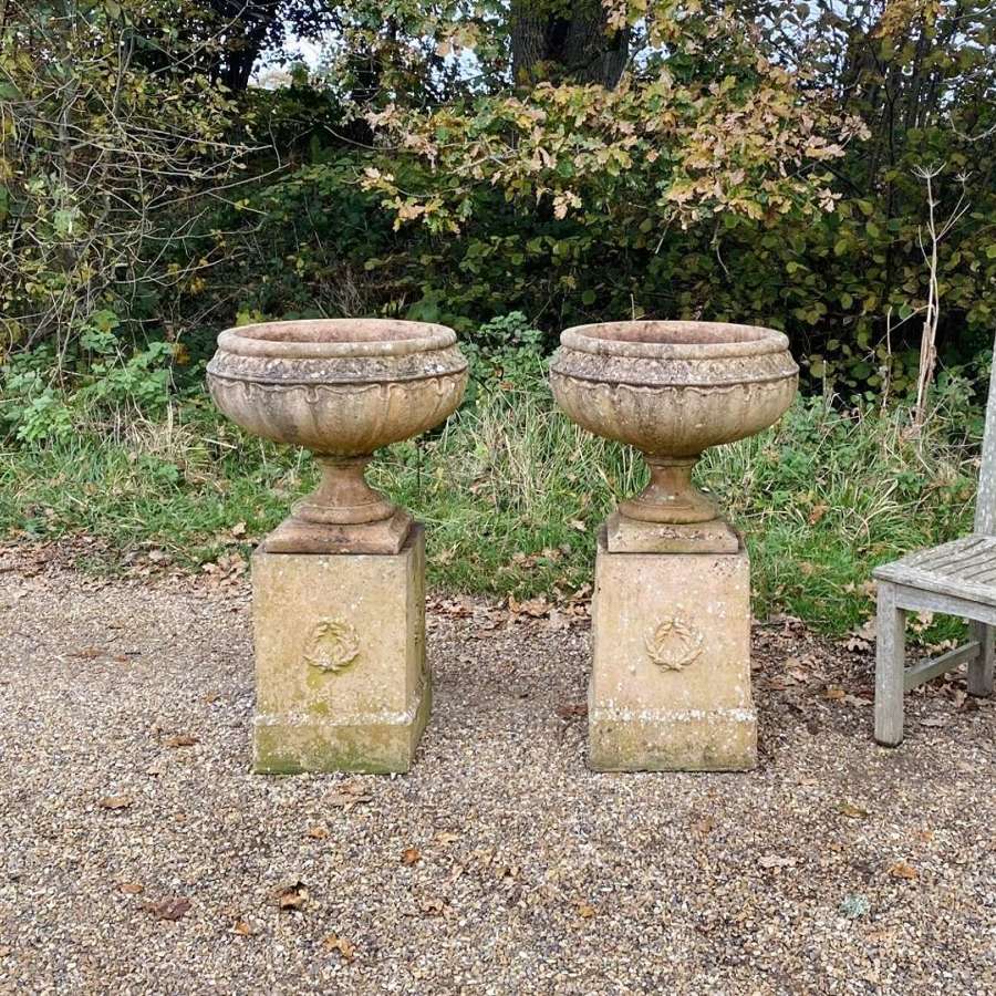 Pair of Decorative Urns with Pedestals