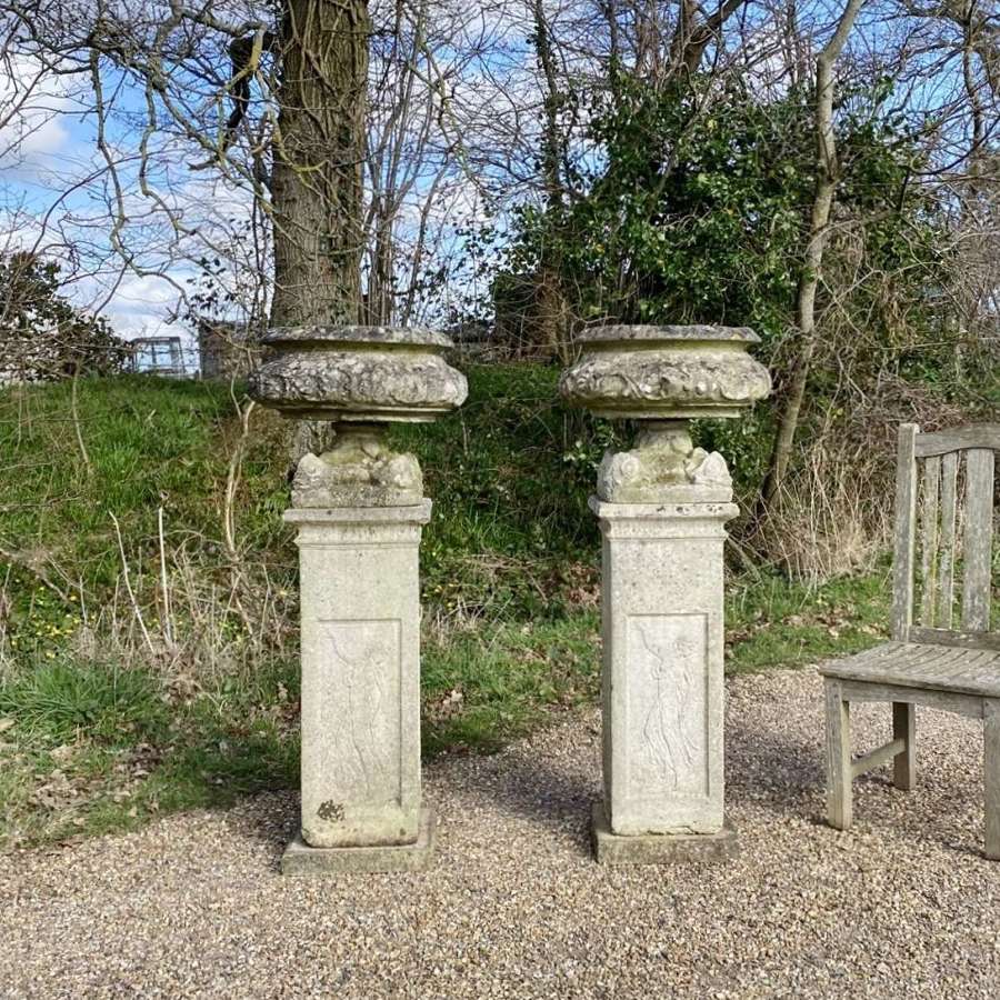 Pair of Decorative Urns on Tall Pedestals