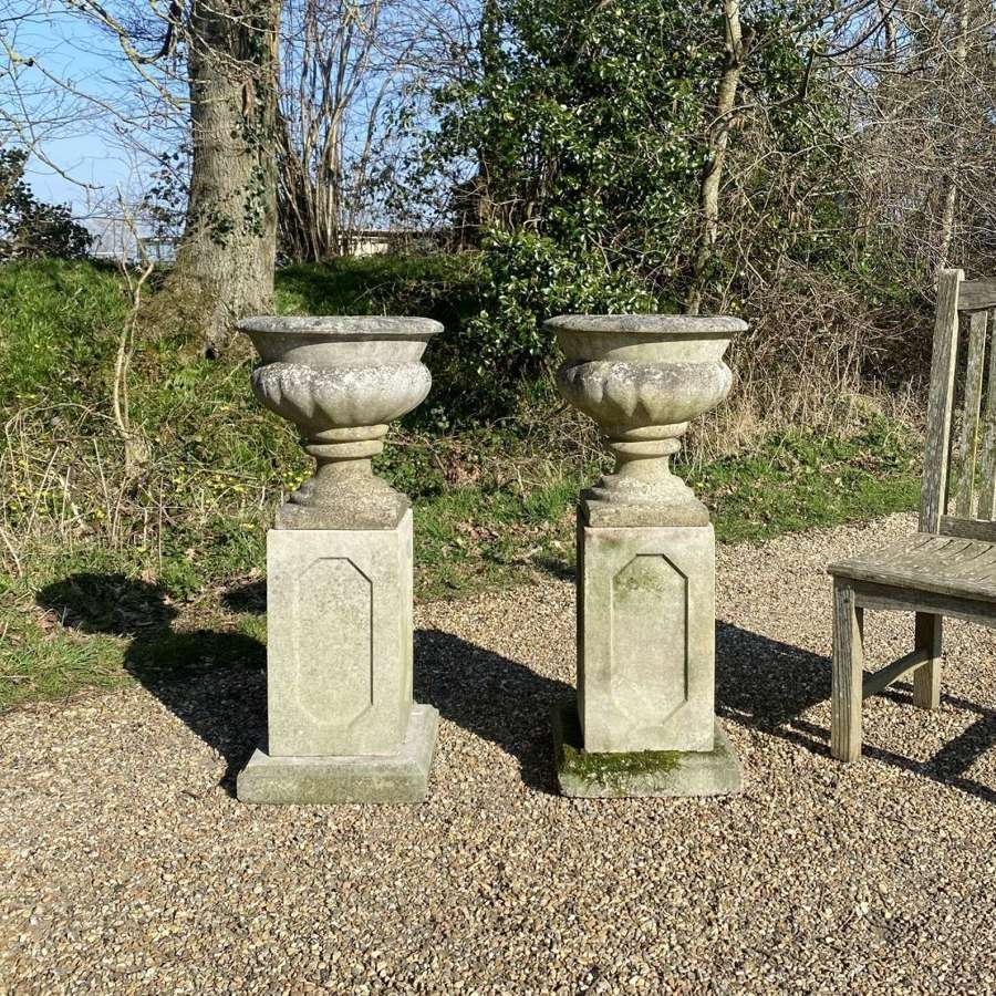 Pair of Small Lobed Urns with Pedestals