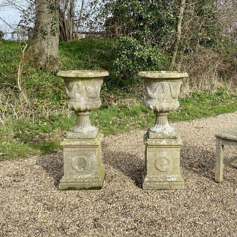 Pair of Garland Urns on Pedestals