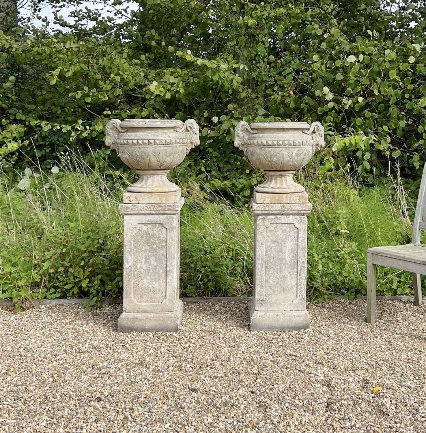 Pair of Decorative Urns on Pedestals