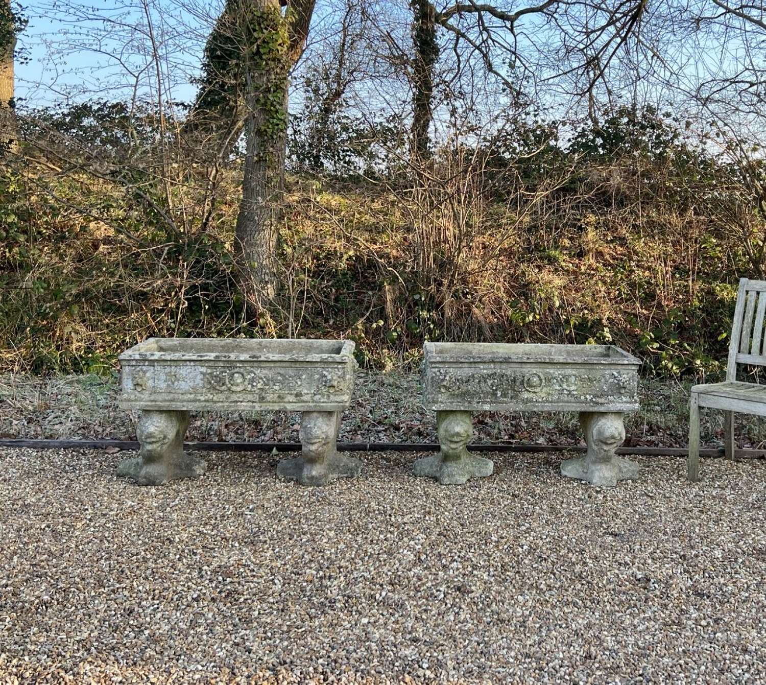 Pair of Patinated Lion Troughs with Feet