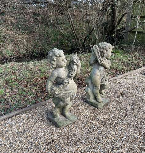 Pair of Patinated Cherubs