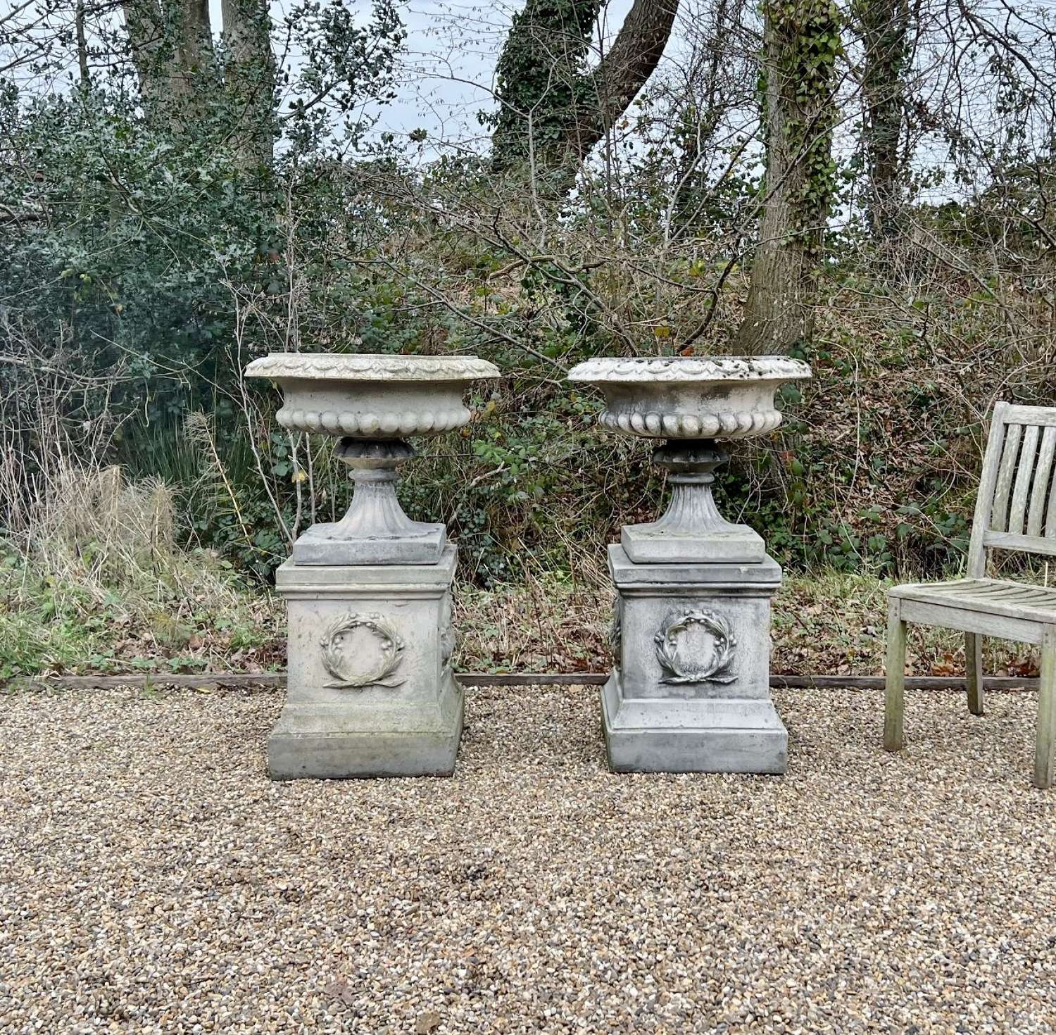 Pair of Large Sandford Stone Urns with Pedestals